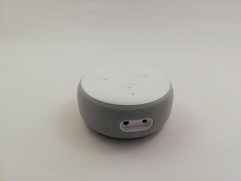 Amazon Echo Dot 3rd generation smart speaker on a white surface