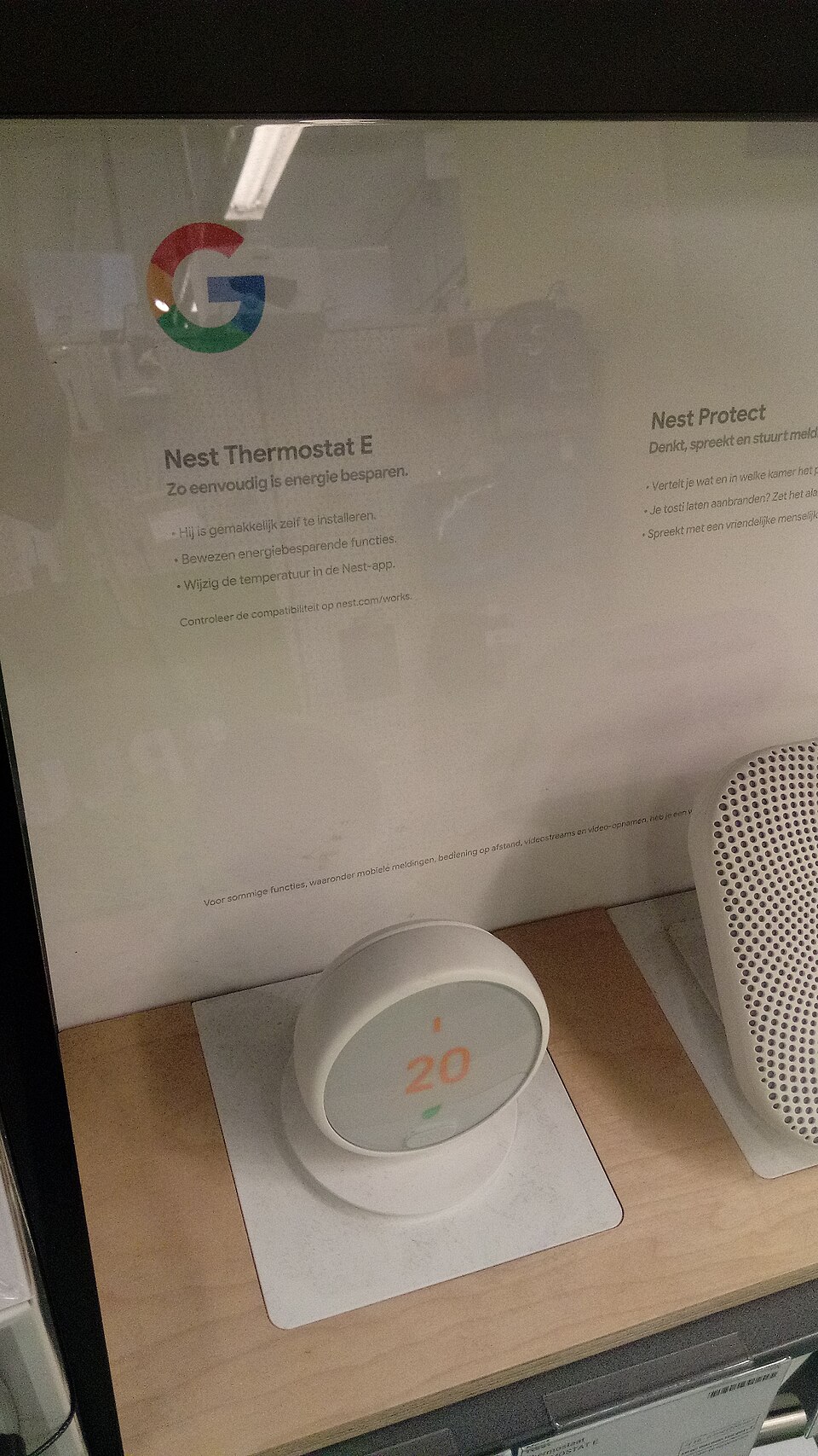 Nest Thermostat E mounted on a white wall