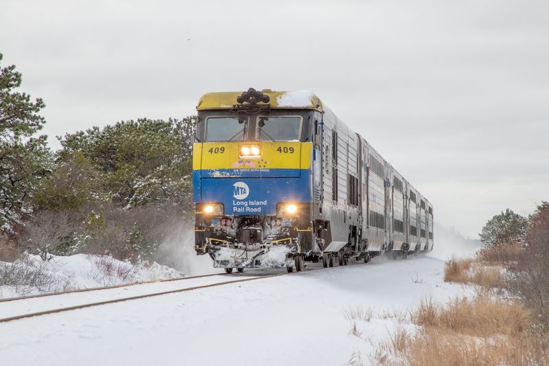 LIRR train passing through Napeague NY in snow