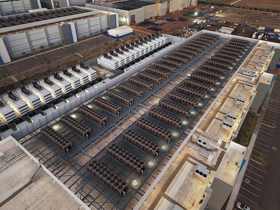 Exterior view of a data center building rooftop with cooling systems