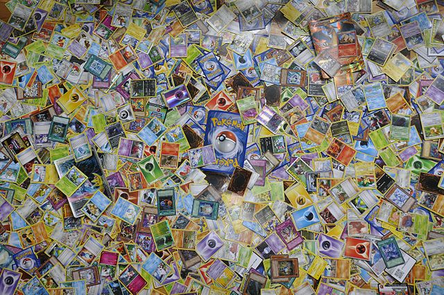 Collection of Pokémon trading cards spread out on display
