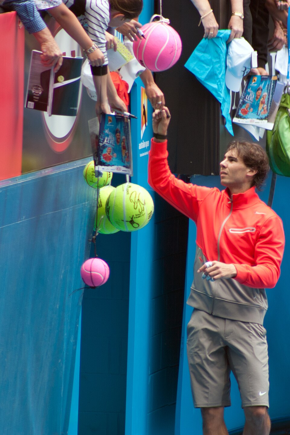 Rafael Nadal signing autographs for fans at Australian Open 2011