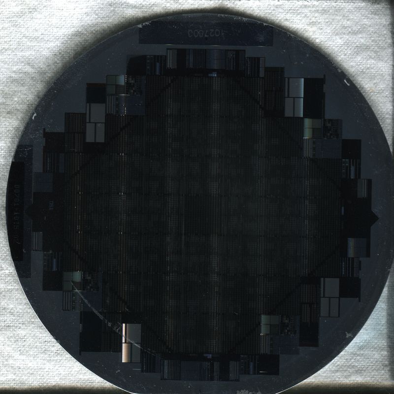 Close-up of a semiconductor wafer showing integrated circuit patterns